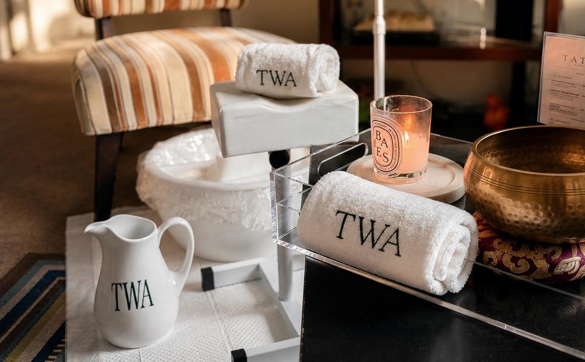 Monogrammed towels, candle and copper bowl detail on the atelier tray